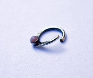 patterned teardrop piercing ring in sterling silver with gemstone