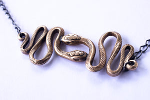 SERPENT double snake necklace in bronze